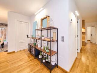 This stunning property boasts a bright and airy hallway with stylish wooden flooring.