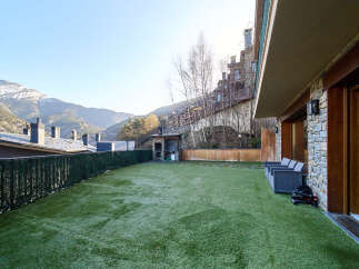 This stunning property boasts a private terrace with artificial turf, perfect for outdoor relaxation.
