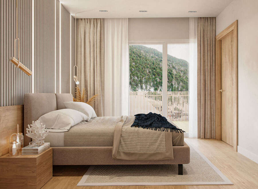 Luxurious mountain view bedroom with a king-size bed and ensuite bathroom.