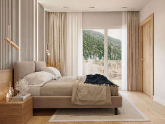 Luxurious mountain view bedroom with a king-size bed and ensuite bathroom.