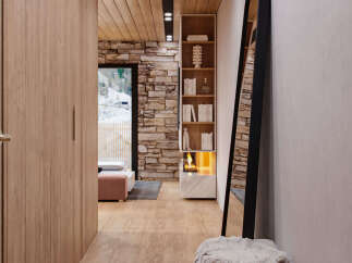 This stunning hallway boasts a modern design with a blend of natural wood and stone.