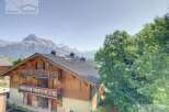 Discover a stunning chalet nestled in the heart of the mountains, offering breathtaking views.