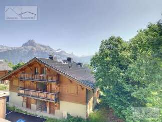 Discover a stunning chalet nestled in the heart of the mountains, offering breathtaking views.