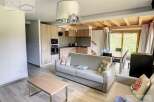 Discover this stunning property featuring a modern kitchen and a cozy living area.