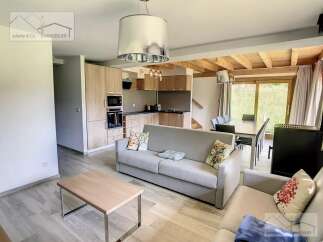 Discover this stunning property featuring a modern kitchen and a cozy living area.
