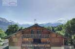 Discover a stunning chalet nestled in the heart of the mountains, offering breathtaking views.