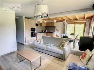 Discover this stunning property featuring a modern kitchen and a cozy living area.