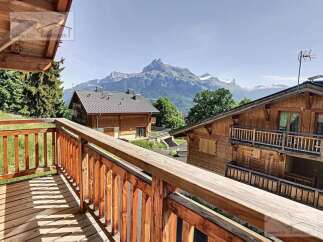Enjoy breathtaking mountain views from this charming chalet.