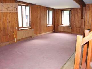 Discover the charm of this inviting property, featuring warm wooden paneling throughout.