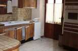 Discover the charm of this kitchen with its classic wooden cabinetry.
