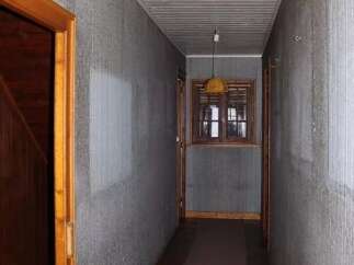 Explore this charming property featuring a cozy hallway with a warm, inviting atmosphere.