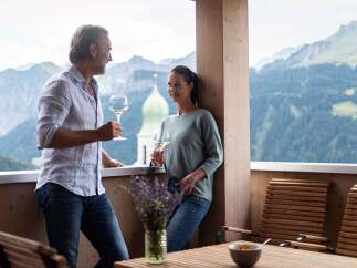 Enjoy breathtaking mountain views from your private balcony, perfect for relaxing with a glass of wine.