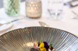 A delectable culinary creation is artfully presented on a sophisticated plate, showcasing a harmonious blend of colors and textures.