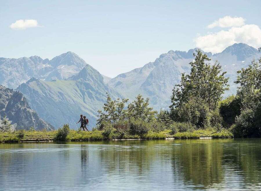 Discover serenity at our lakeside retreat, nestled amidst breathtaking mountain vistas.