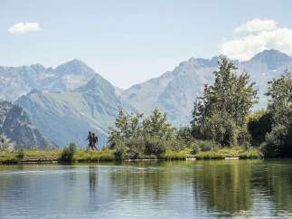 Discover serenity at our lakeside retreat, nestled amidst breathtaking mountain vistas.