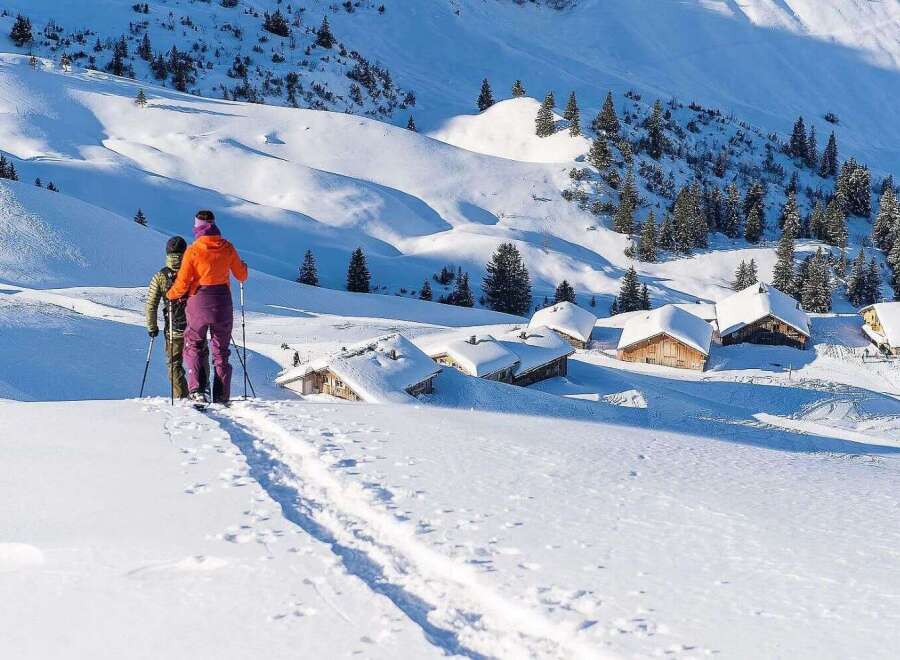 Discover the magic of winter in this idyllic snow-covered village nestled high in the mountains.