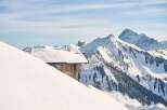 Nestled in a breathtaking snowy mountain range, this charming wooden cabin offers unparalleled seclusion and stunning views.
