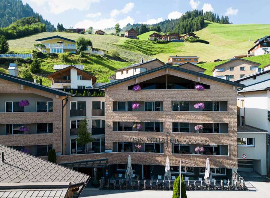 Nestled in a picturesque mountain setting, Das Schafer Hotel boasts stunning views and modern architecture.
