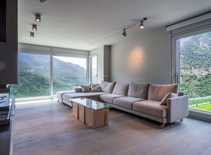 Stunning mountain views from this luxurious living room.