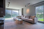 Stunning mountain views from this luxurious living room.