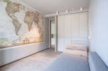 This stunning property boasts a spacious room with built-in wardrobes and a comfortable daybed, perfect for relaxation.