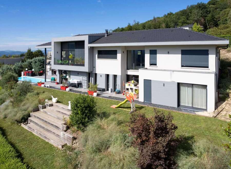 Stunning contemporary home boasts panoramic views and a private pool.