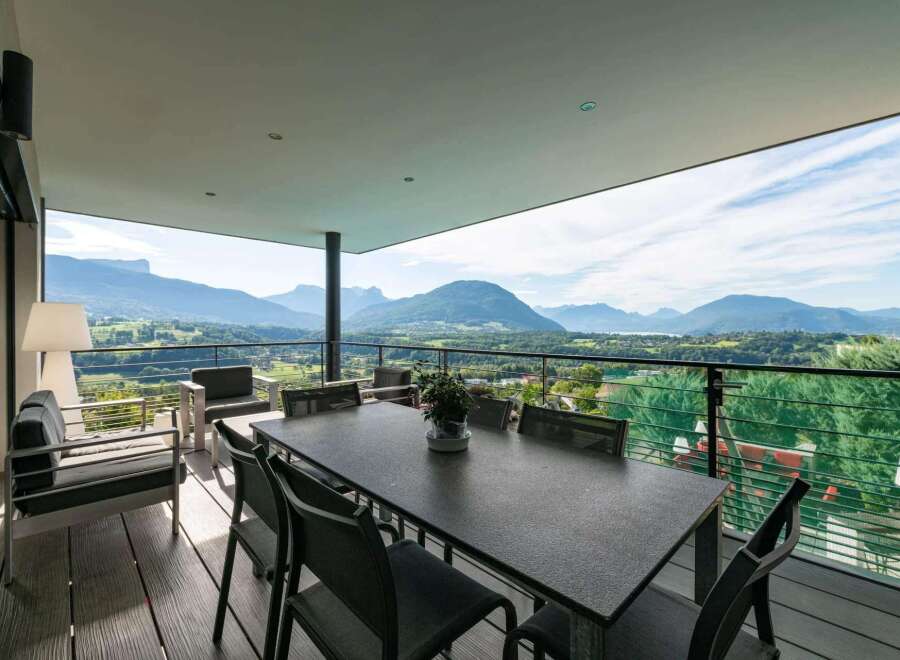 This stunning property boasts breathtaking panoramic mountain views from its expansive balcony.