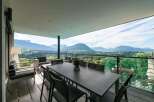 This stunning property boasts breathtaking panoramic mountain views from its expansive balcony.