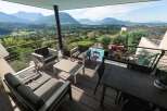 Luxury balcony with mountain views and a private pool.