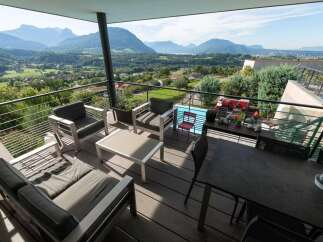 Luxury balcony with mountain views and a private pool.