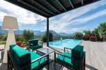Luxury villa with infinity pool boasting breathtaking mountain views.
