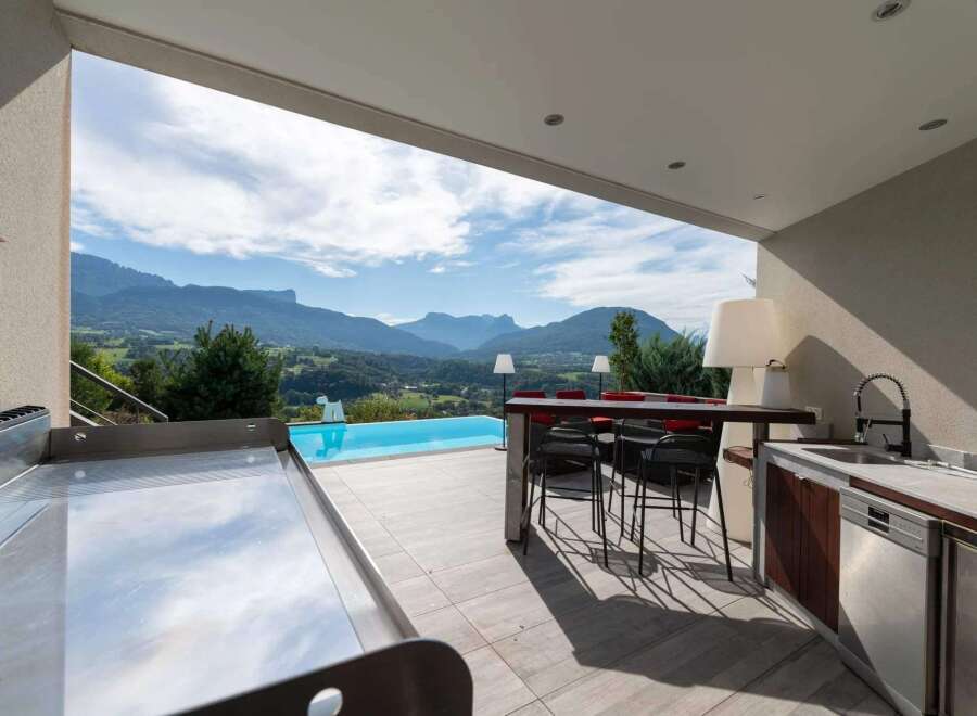 Luxury outdoor kitchen with stunning mountain views.