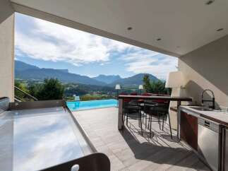 Luxury outdoor kitchen with stunning mountain views.