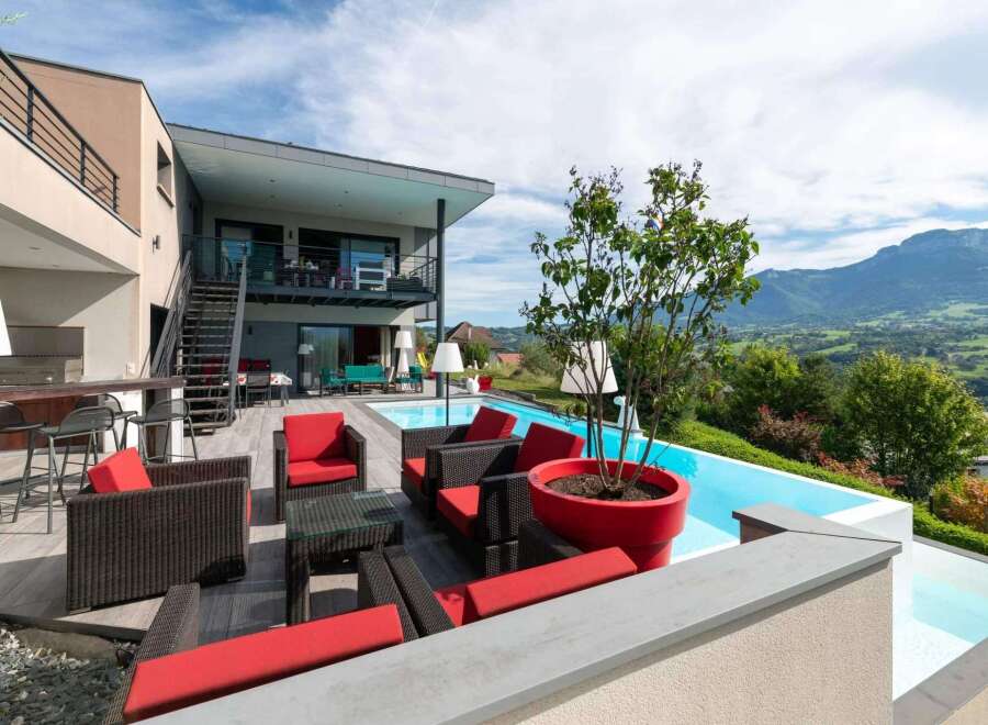 Luxury mountain villa with infinity pool and stunning views.