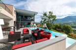 Luxury mountain villa with infinity pool and stunning views.