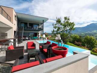 Luxury mountain villa with infinity pool and stunning views.