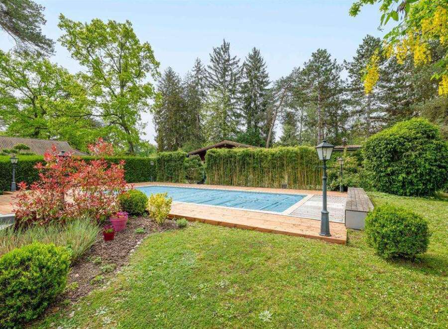 This stunning property boasts a beautiful, secluded pool area, perfect for relaxation and entertaining.