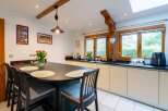 This stunning kitchen boasts a spacious island with seating, perfect for casual dining and entertaining.
