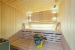 Relax and rejuvenate in this exquisite sauna, featuring calming LED lighting and premium wood paneling.