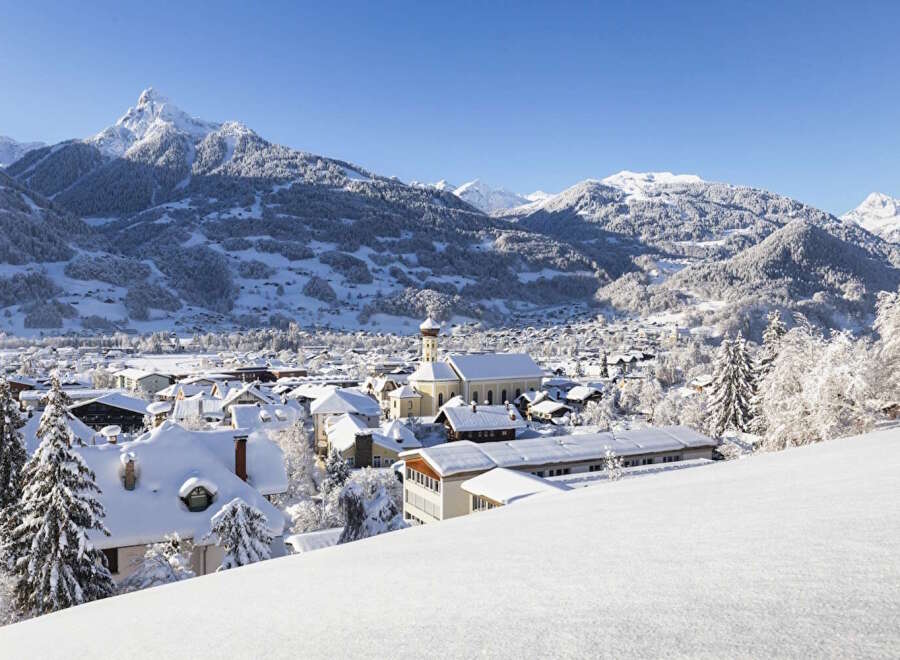 Nestled in a picturesque snowy mountain valley, this charming village offers breathtaking views and a peaceful atmosphere.