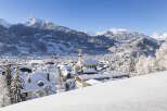 Nestled in a picturesque snowy mountain valley, this charming village offers breathtaking views and a peaceful atmosphere.