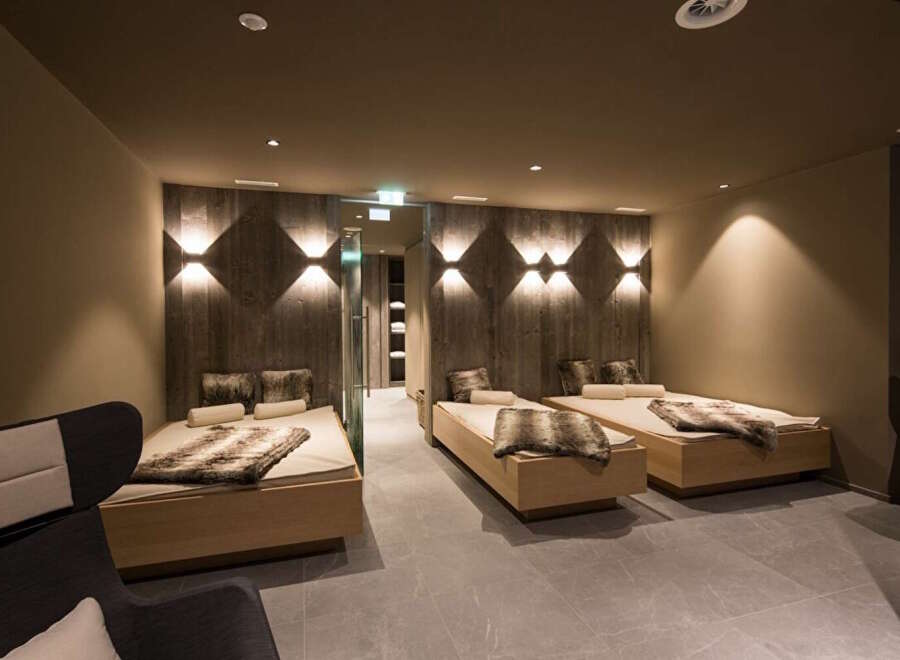 Relax and unwind in our luxurious spa, featuring comfortable heated loungers perfect for post-treatment relaxation.