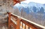 Mountain View Chalet with Wooden Balcony.