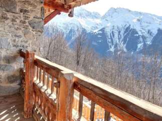 Mountain View Chalet with Wooden Balcony.