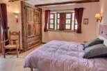 Cozy bedroom with mountain views and rustic charm.