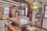 Rustic mountain chalet with charming wooden dining table and benches.