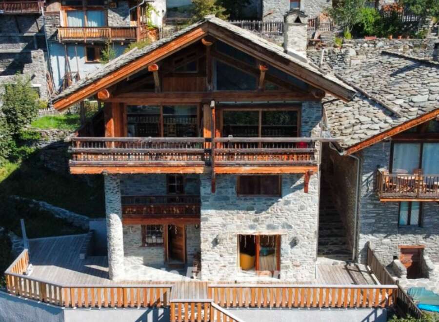 This stunning chalet boasts a unique blend of rustic charm and modern amenities.