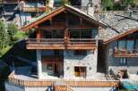 This stunning chalet boasts a unique blend of rustic charm and modern amenities.