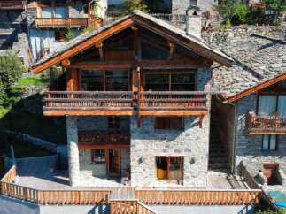 This stunning chalet boasts a unique blend of rustic charm and modern amenities.