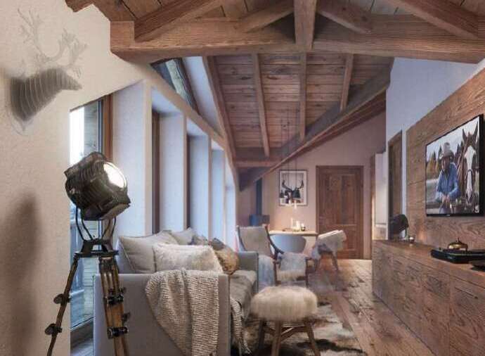 Rustic mountain chalet with exposed wood beams and a cozy living area.